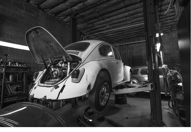 A picture of a Volkswagen Beetle getting some work done on it with some parts from MbenzGram (MBGRAM